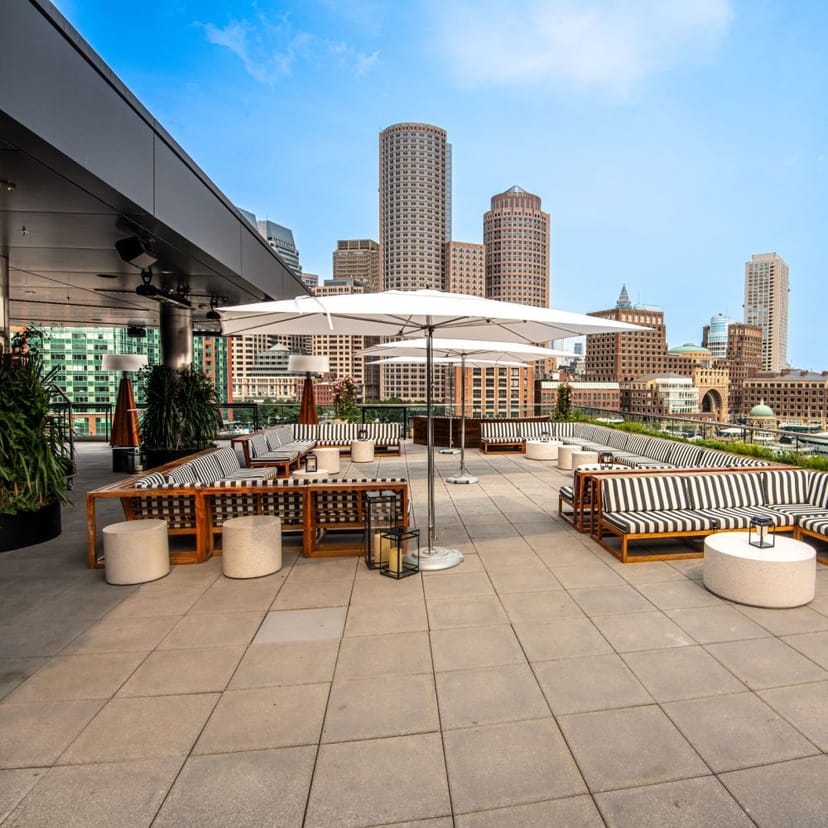 Stylish rooftop bar at The Envoy Hotel, ideal for events with city skyline views.
