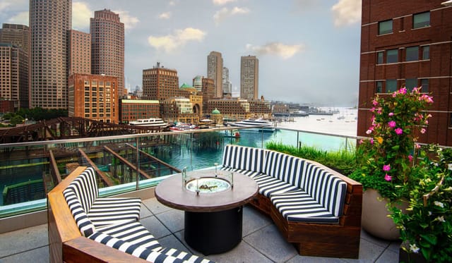 Rooftop Bar at The Envoy Hotel with city skyline view, ideal for networking events.