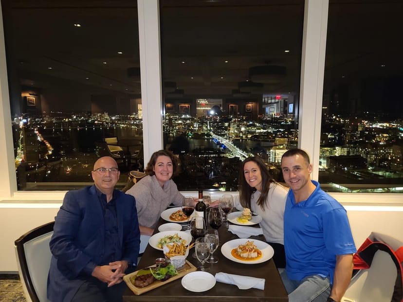 Dining room at UMass Club with skyline view, ideal for networking and celebrations.