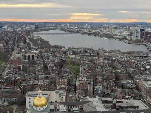 Aerial view of UMass Club dining room with skyline, ideal for conferences and events.