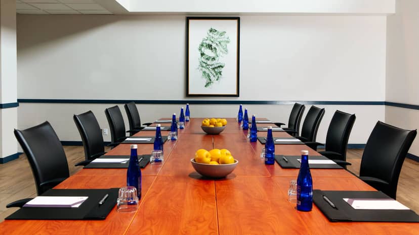 Conference room in Boston Marriott Cambridge with wooden table, ideal for professional meetings.