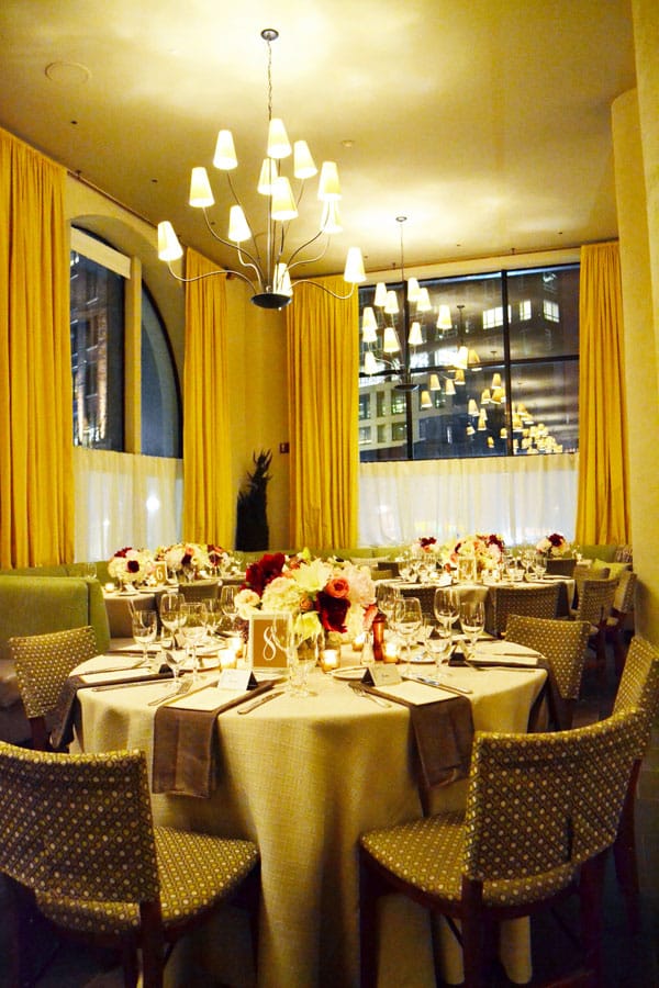 Elegant private dining room with floral centerpieces for upscale receptions and formal dinners.