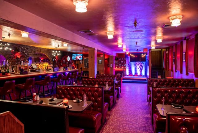 Vibrant indoor event space at Alibi Bar & Lounge, ideal for parties and networking.