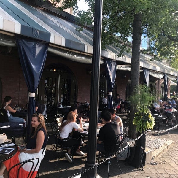 Waterfront patio in Tias, ideal for casual networking events with stylish seating.