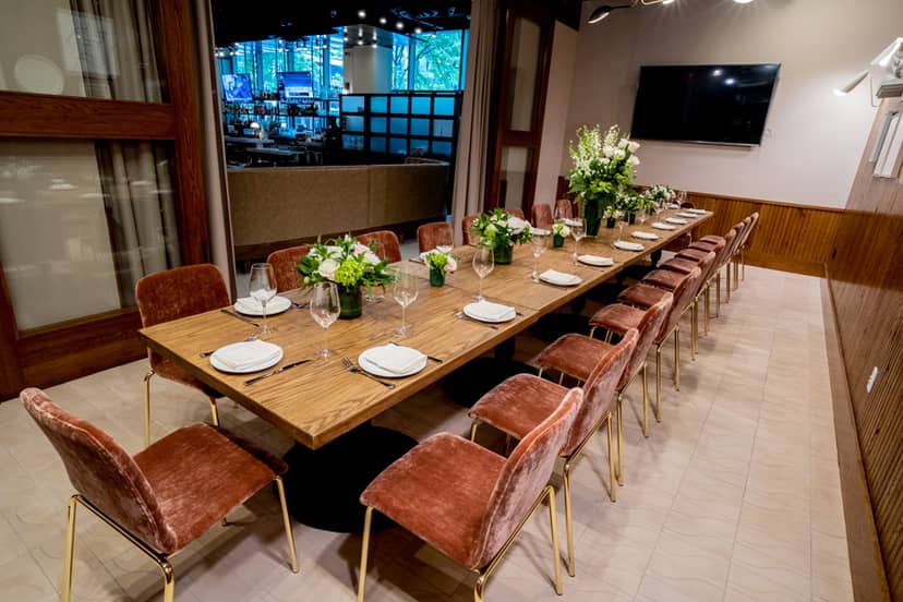 Private dining room with elegant table setting for exclusive events and meetings.