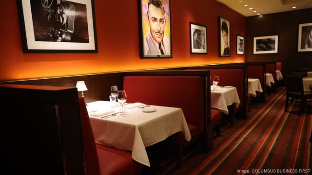 Private dining booth with elegant glassware in upscale restaurant setting.