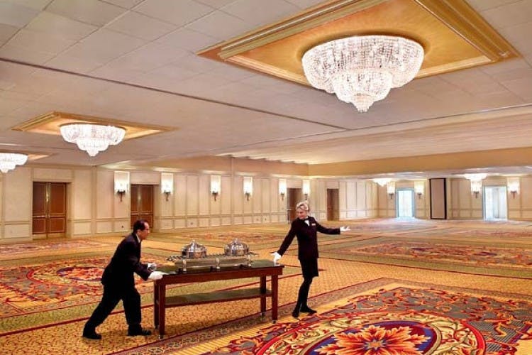 Commonwealth Ballroom at Boston Marriott Newton, elegant event space with chandeliers.