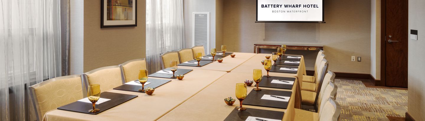 Elegant meeting room at Battery Wharf Hotel, ideal for corporate events and presentations.