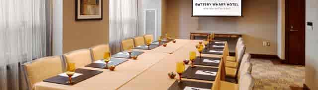 Elegant meeting room at Battery Wharf Hotel, perfect for corporate events and workshops.