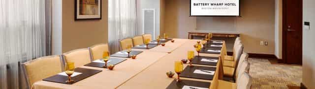 Elegant meeting room at Battery Wharf Hotel, perfect for corporate events and workshops.