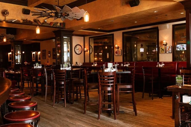 Private dining room at Back Bay Social, warm lighting, ideal for corporate events and gatherings.