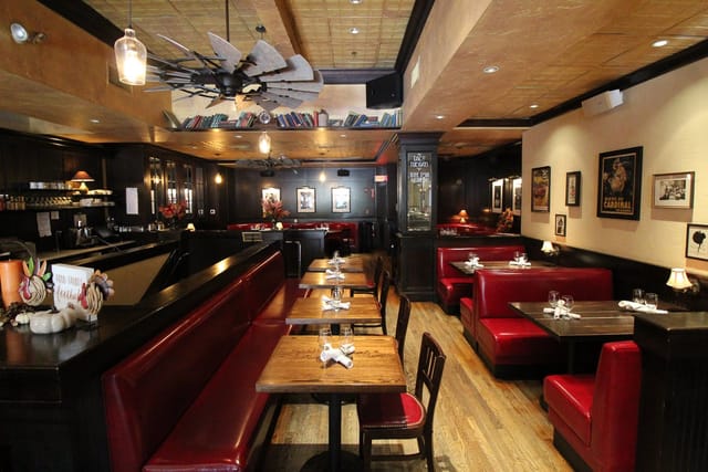 Cozy private dining room with plush red booths for intimate gatherings in Back Bay Social.