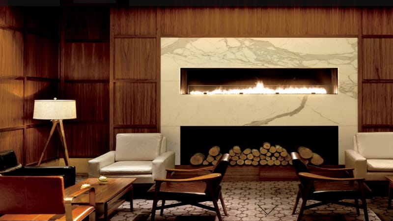 Sophisticated lounge at The Ritz-Carlton, Boston with modern fireplace for upscale events.