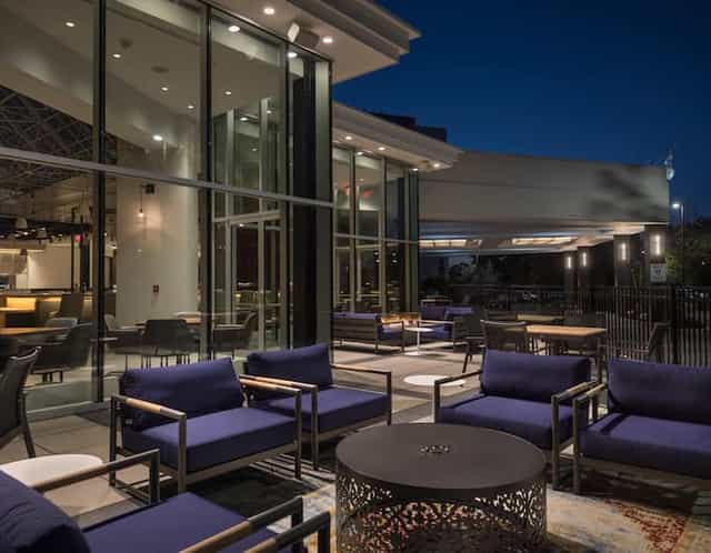 Modern outdoor lounge at Hilton Boston/Woburn, ideal for networking events and receptions.