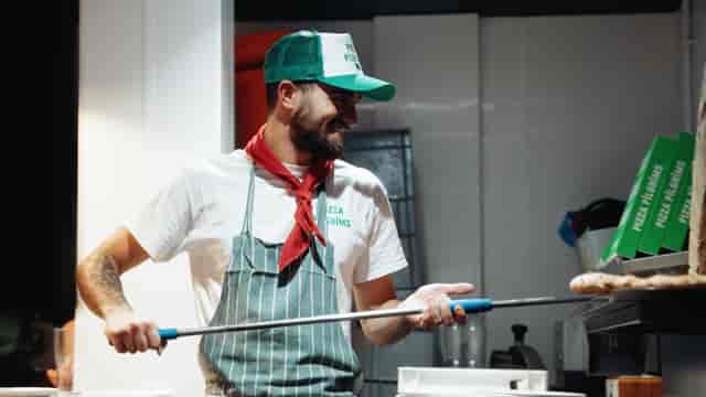 "Interactive pizza making event with vibrant chef at Pizza Pilgrims."