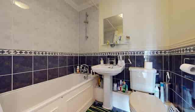 Well-maintained bathroom with bathtub for event venue comfort and aesthetics.