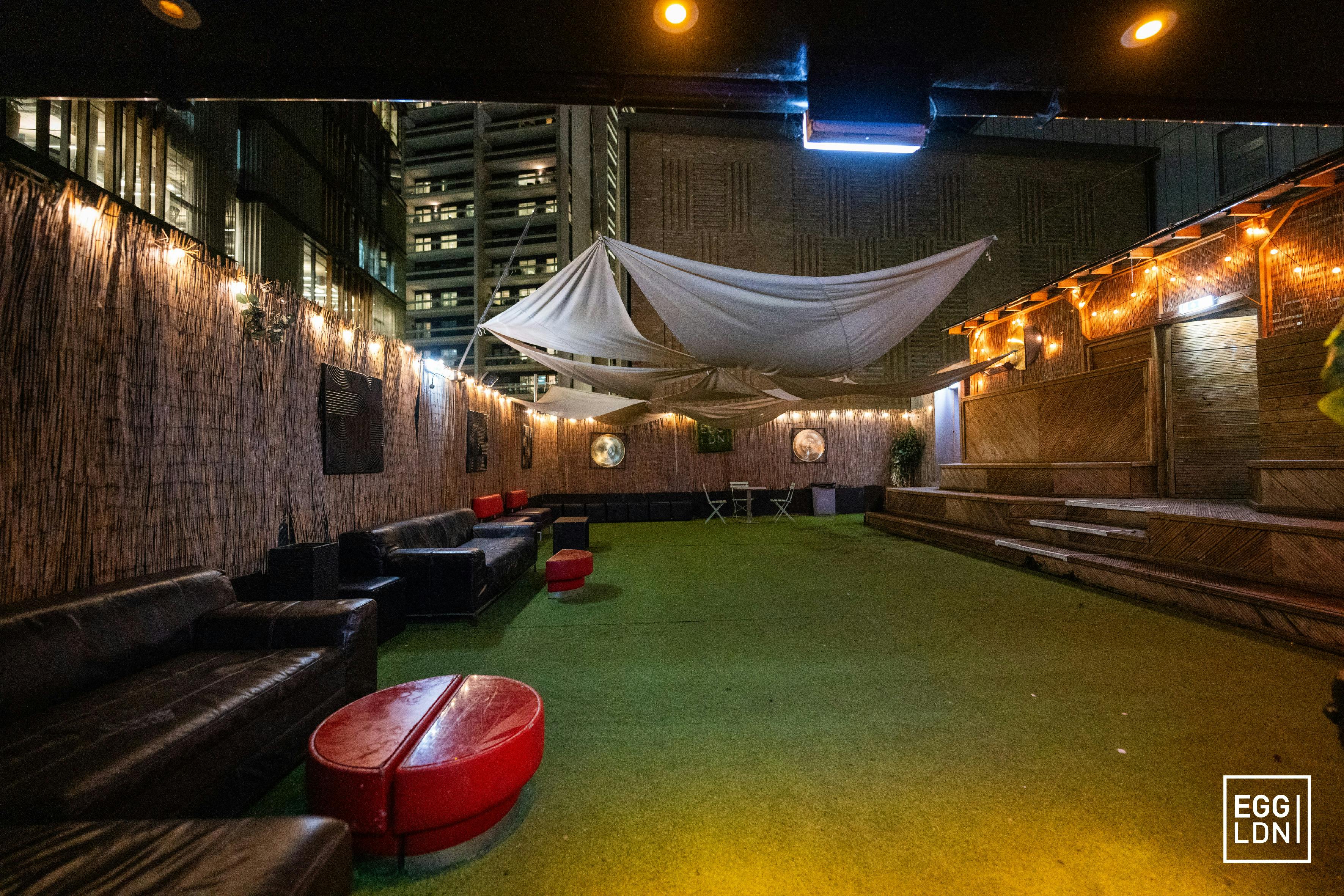 Stylish outdoor event space with cozy seating at The Garden Terrace, Egg LDN.