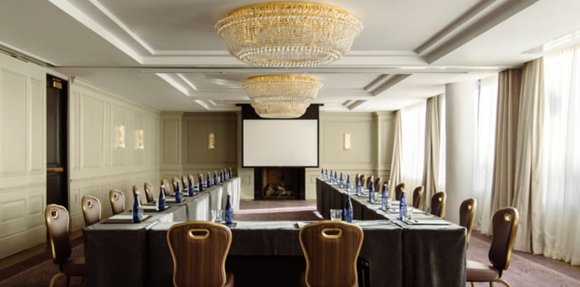 Elegant meeting room at The Dupont Circle Hotel with chandeliers, perfect for workshops.
