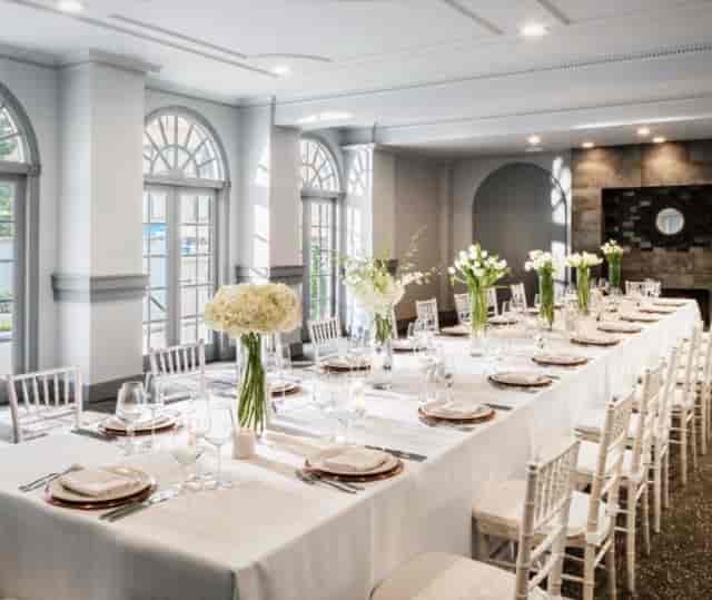 Elegant event space at The Bader Ginsburg, featuring fine dining and floral decor.