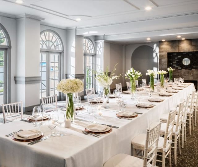 Elegant event space at The Bader Ginsburg, featuring fine dining and floral decor.