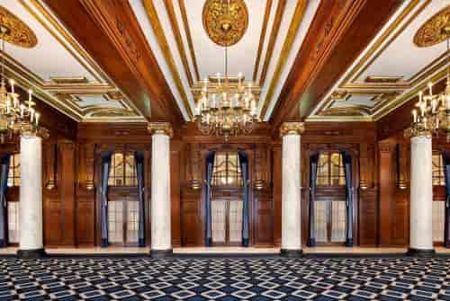Willard Room ballroom with ornate chandeliers, ideal for luxury weddings and corporate galas.