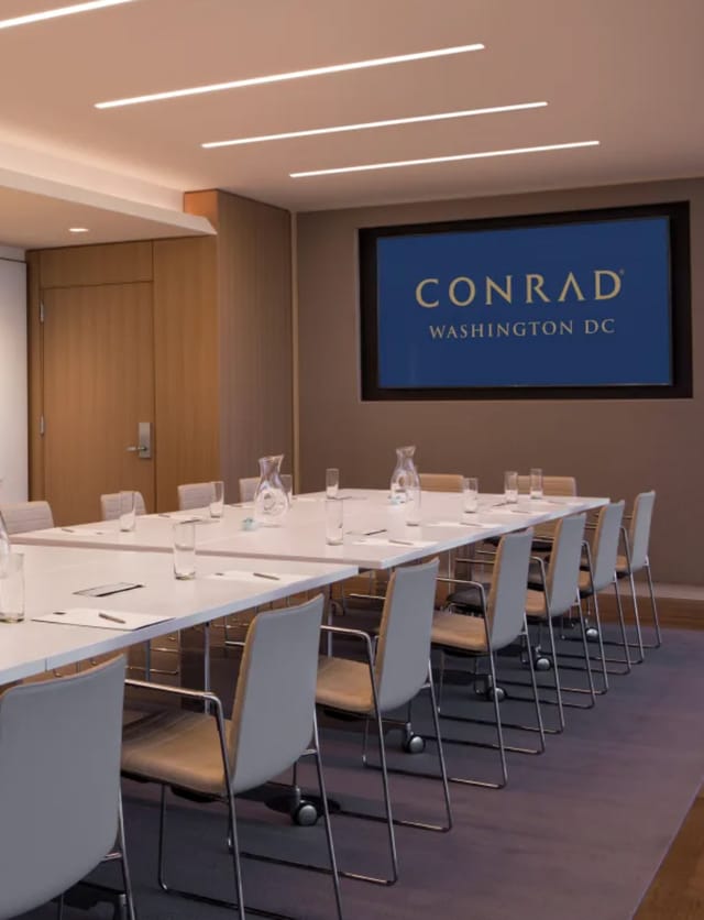 Modern meeting room at Conrad Washington DC, ideal for professional events and gatherings.