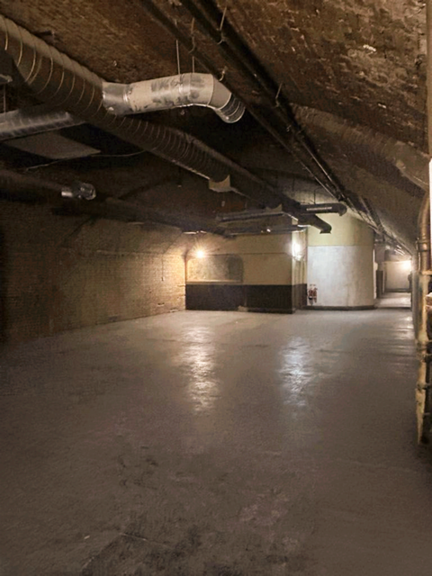Spacious industrial venue with exposed brick for unique events at One America Square. - Banner