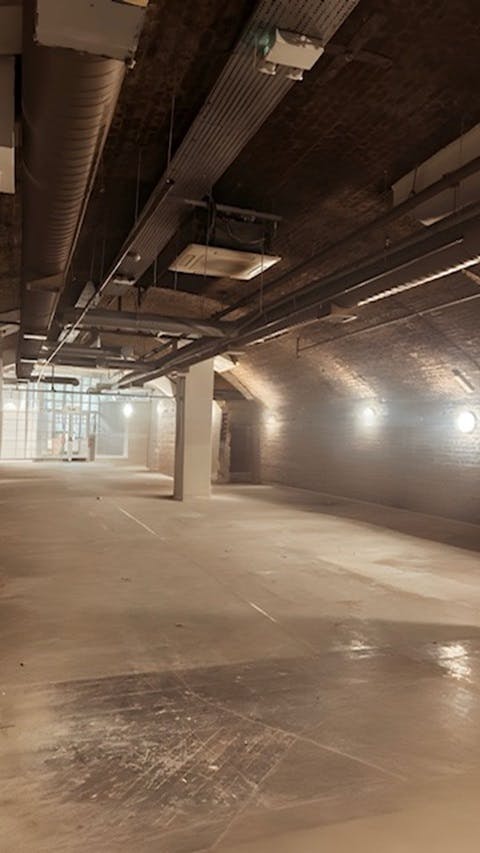 Spacious industrial venue with exposed brick for creative events at One America Square.