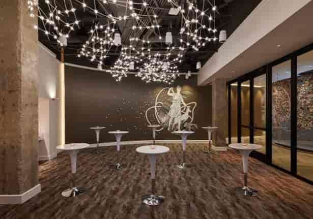 Modern event space in Hotel Zena with artistic lighting for corporate and social gatherings.