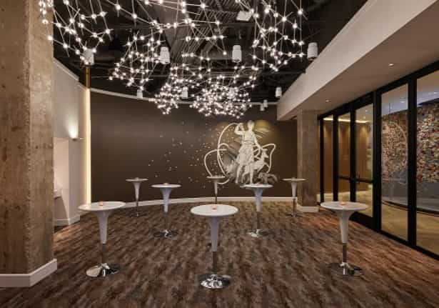 Modern event space in Hotel Zena with artistic lighting for corporate and social gatherings.