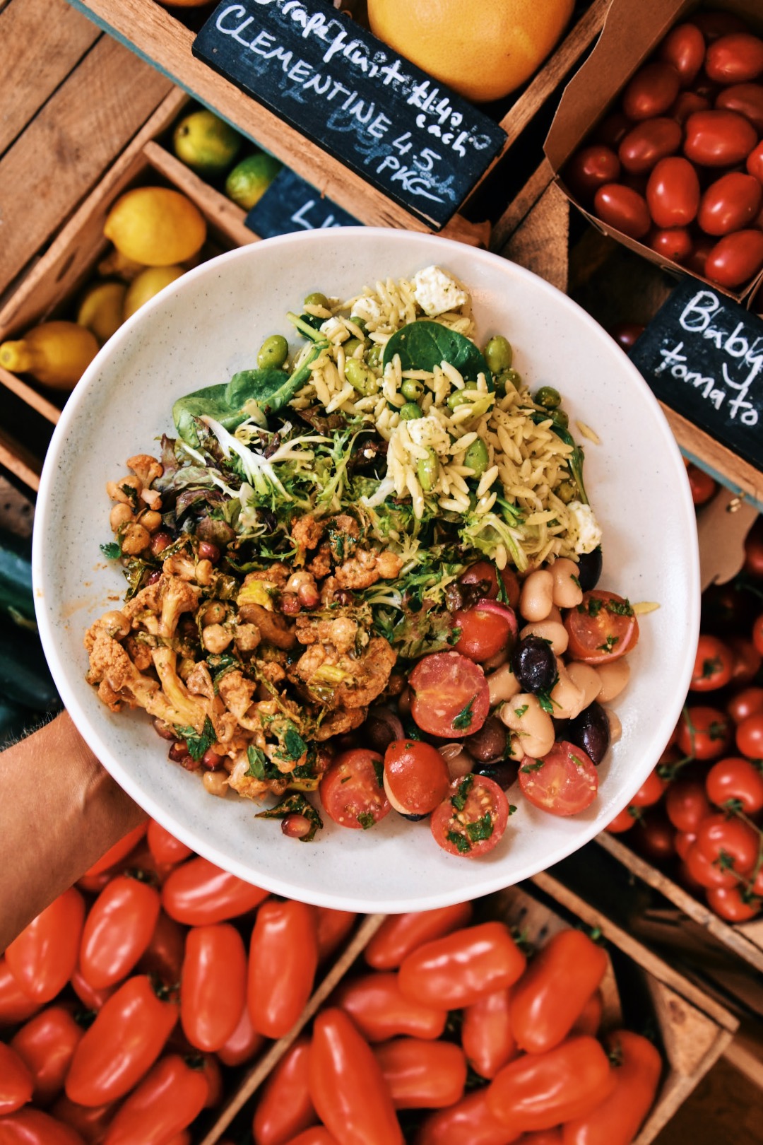 Vibrant bowl of fresh ingredients for catering at Gladwell's Deli & Grocery events. - Banner