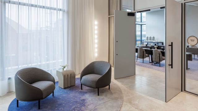 Modern meeting space in The Morrow Hotel, ideal for networking and informal discussions.