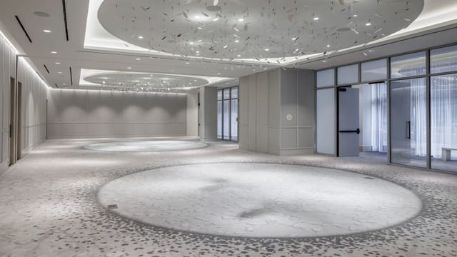 Armature Ballroom at The Morrow Hotel: modern event venue with elegant lighting for receptions.
