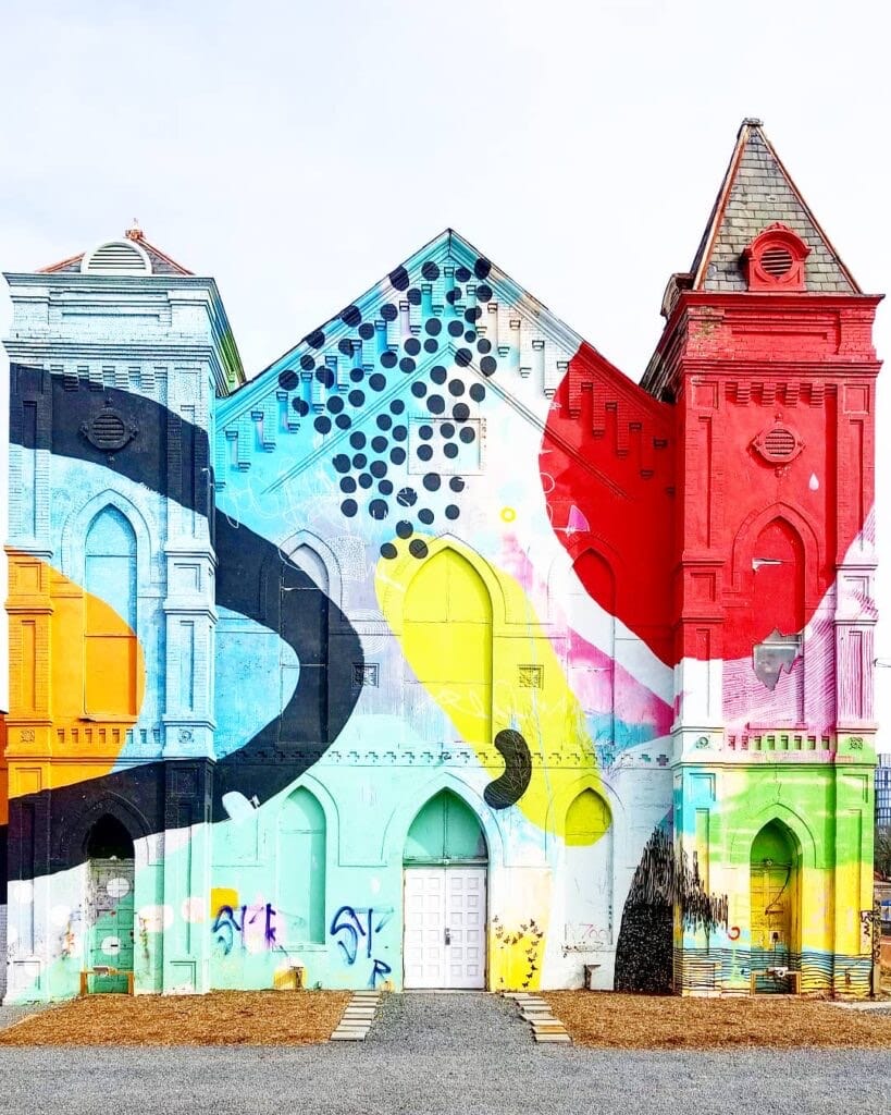 Vibrant mural lounge in Culture House, perfect for art exhibitions and social events.