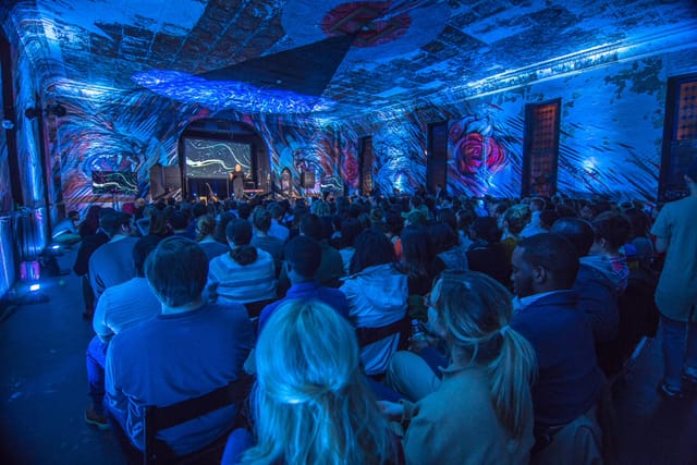 Vibrant Culture House lounge with dynamic lighting for engaging panel discussions.