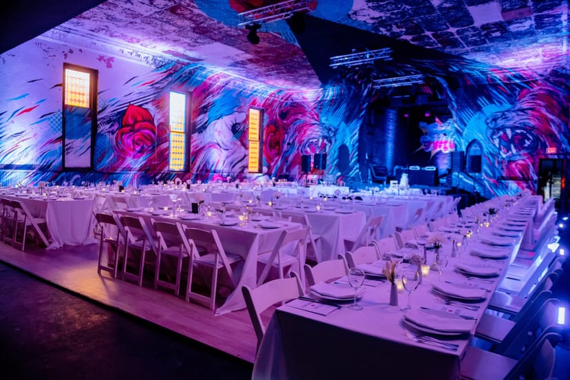 Vibrant event space with mural, ideal for corporate events and upscale celebrations.