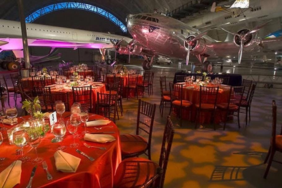 Executive Boardroom at National Air and Space Museum with red linens, ideal for corporate events.