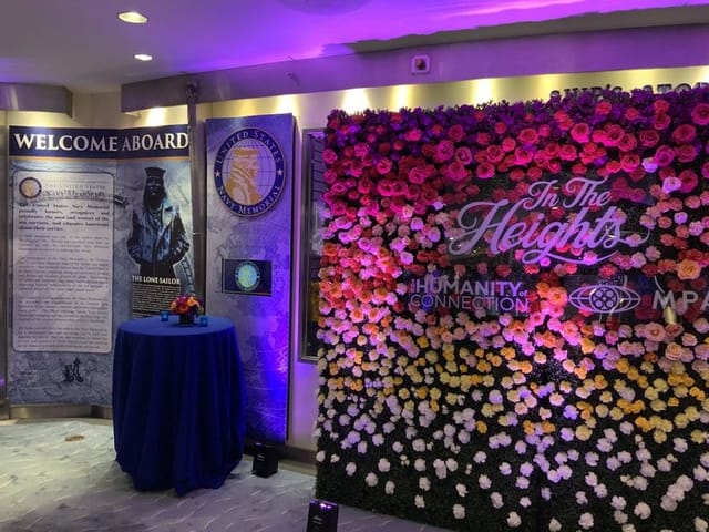 Arleigh & Roberta Burke Theatre floral backdrop for "In The Heights" event networking.