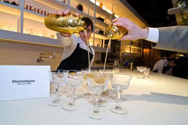 Bartender pouring cocktails at upscale Minibar & Barmini for events and meetings.