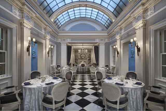 Elegant event space in The Gallatin Room, featuring high ceilings and upscale decor.