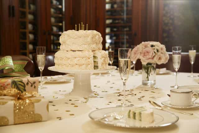 Elegant table with cake in The Jefferson's Private Wine Cellar for weddings and anniversaries.