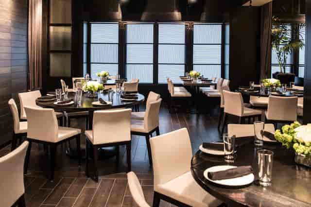 Sophisticated RPM Italian D.C. dining space with elegant round tables for events.