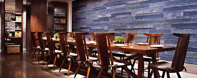 Intimate meeting space at Blue Duck Tavern with a long wooden table and stylish decor.