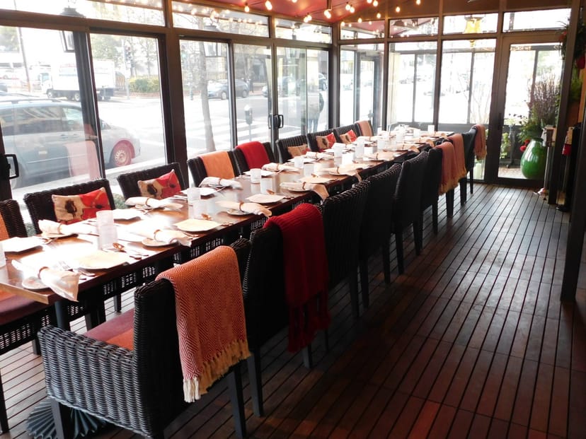 Elegant dining setup in bright Sfoglina Pasta House for events and gatherings.