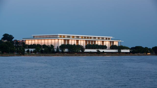 Kennedy Center theater with illuminated facade, ideal for upscale events and gatherings.