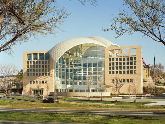Modern event space with glass windows at United States Institute of Peace for conferences.