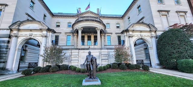 Elegant Anderson House mansion with statue, perfect for corporate events and receptions.