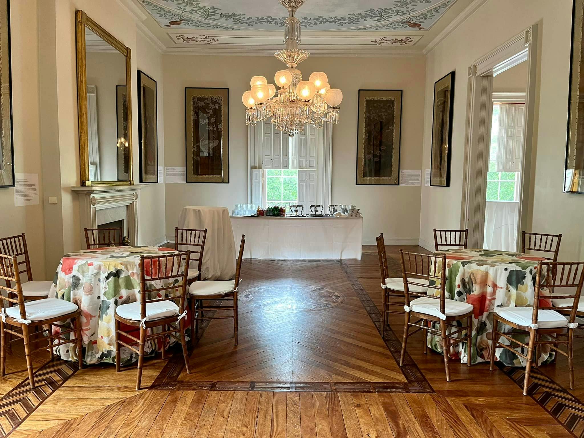 Belle Vue Room at Dumbarton House with elegant tables, ideal for networking events.