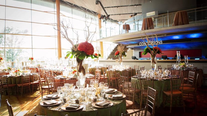 Elegant event space at Catwalk Cafe, featuring fine china and floral centerpieces.