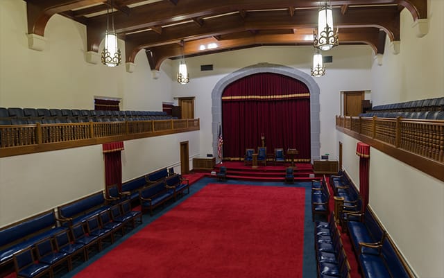 Elegant conference room with tiered seating at George Washington Masonic National Memorial.